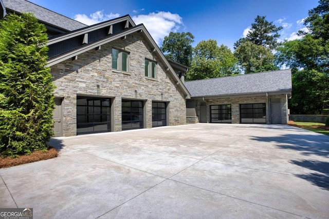 view of side of home with a garage