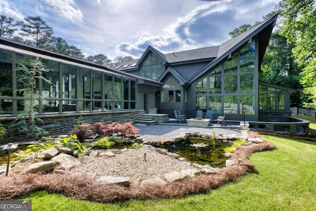 back of property featuring a sunroom