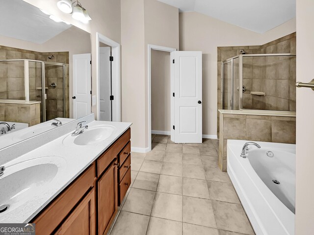 bathroom with tile patterned flooring, vanity, independent shower and bath, and lofted ceiling