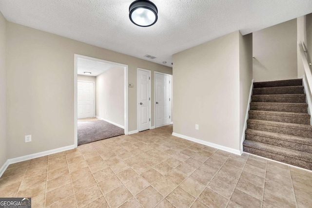 interior space with a textured ceiling