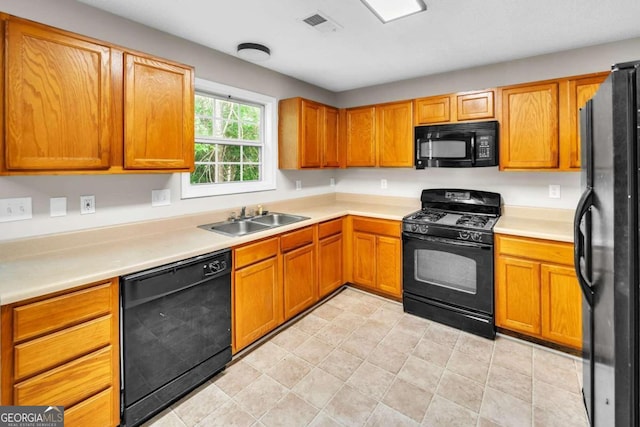 kitchen featuring sink and black appliances