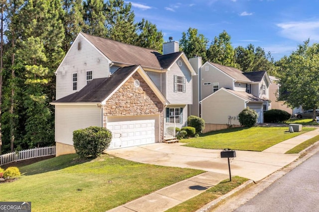 view of property featuring a garage and a front yard