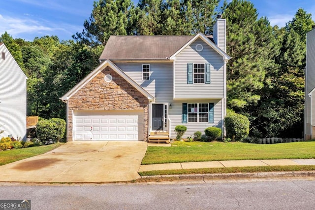 view of front property with a garage and a front lawn