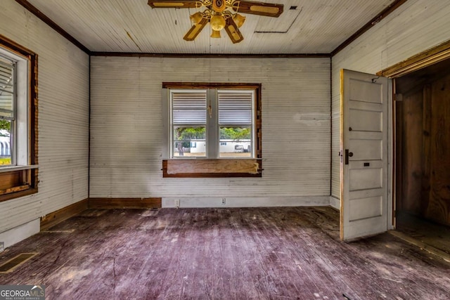 spare room featuring ceiling fan, dark hardwood / wood-style flooring, and ornamental molding