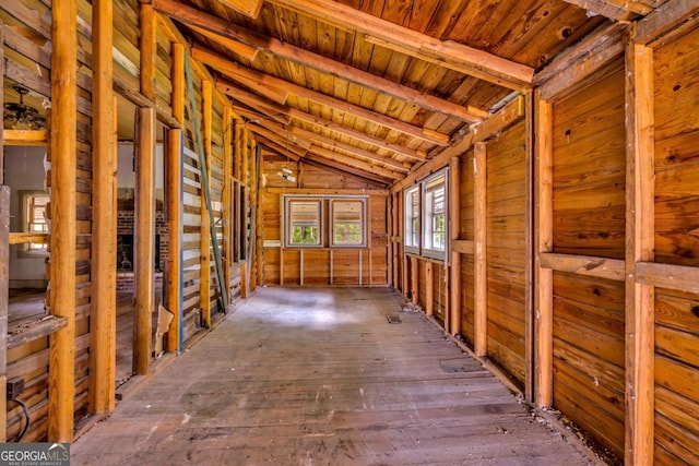 miscellaneous room with lofted ceiling with beams, wood ceiling, and dark wood-type flooring