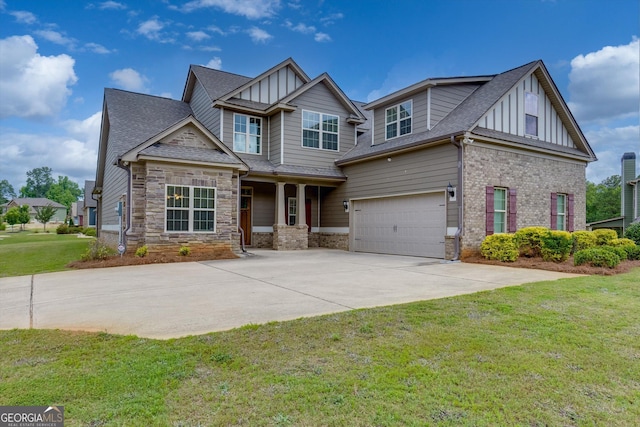 craftsman house with a front yard and a garage