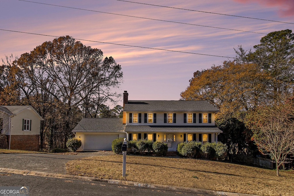 colonial inspired home featuring a garage