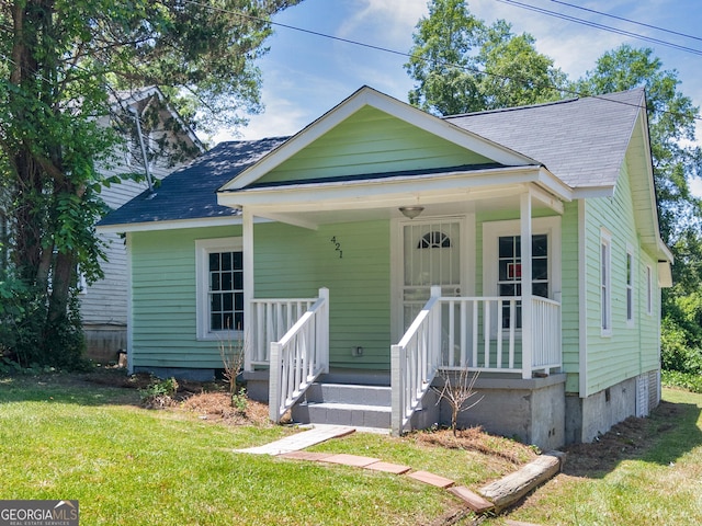 bungalow-style house with a front lawn