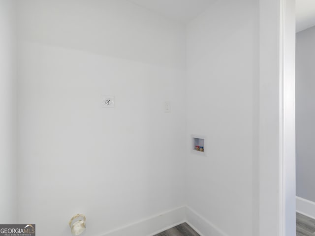 washroom featuring hookup for an electric dryer, hookup for a washing machine, and hardwood / wood-style flooring