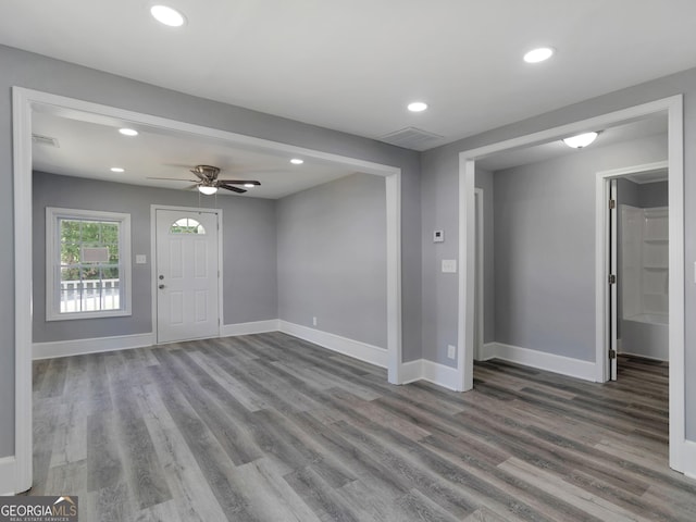 interior space featuring ceiling fan and wood-type flooring