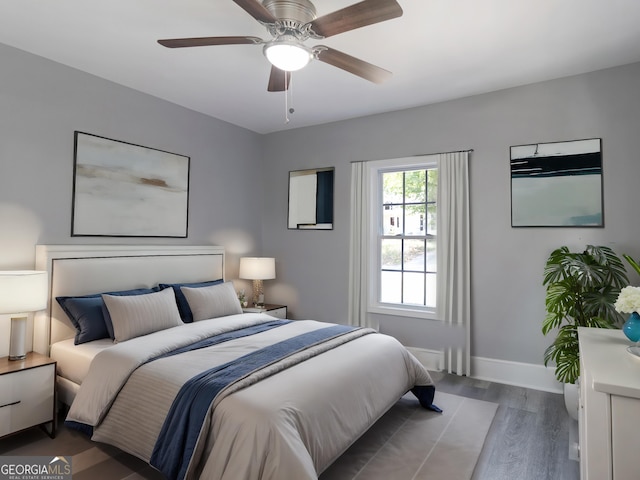 bedroom with ceiling fan and hardwood / wood-style floors