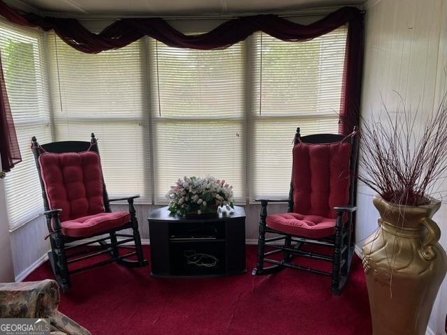 sitting room featuring carpet