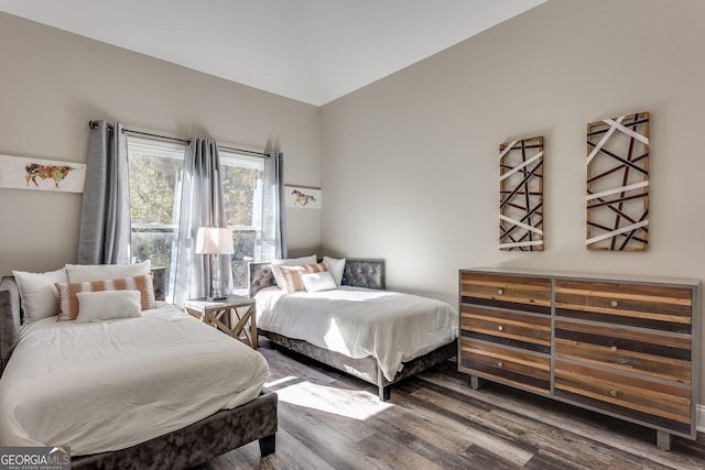 bedroom with hardwood / wood-style flooring