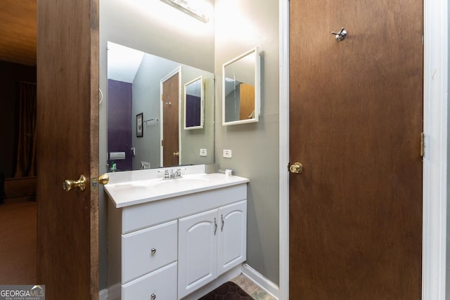 bathroom featuring vanity and tile floors