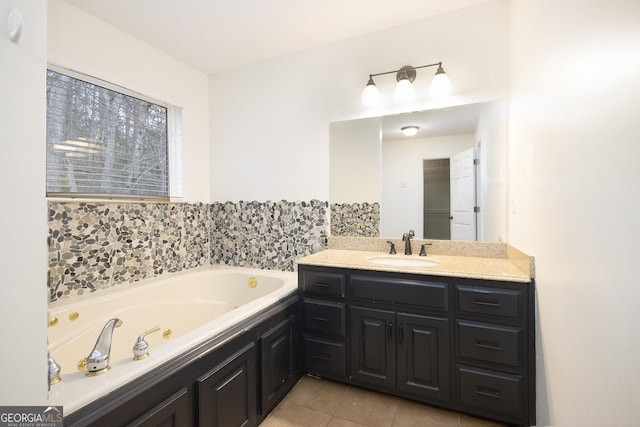 bathroom with tile patterned flooring, vanity, and a bathtub