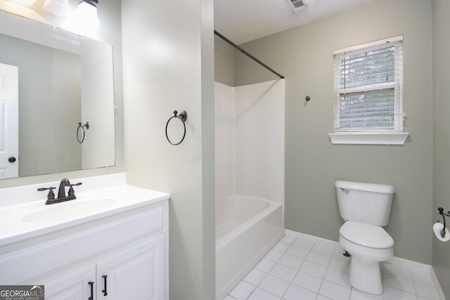 full bathroom featuring washtub / shower combination, vanity, a textured ceiling, tile patterned flooring, and toilet