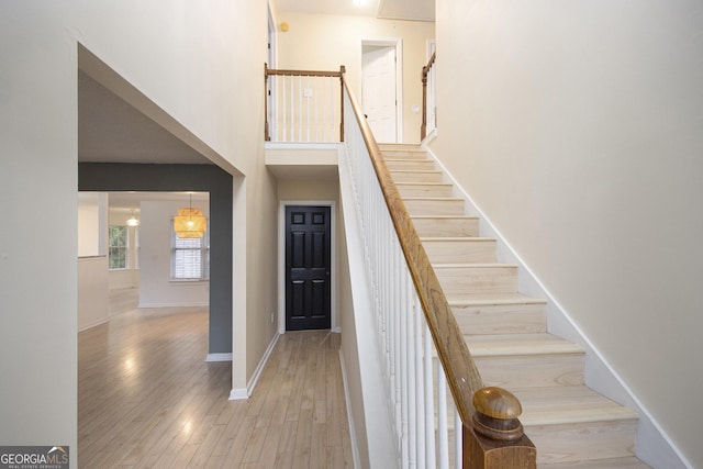 stairway featuring wood-type flooring