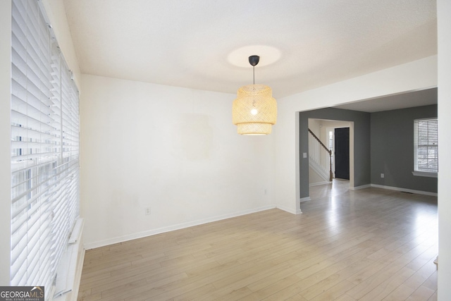 spare room with light wood-type flooring