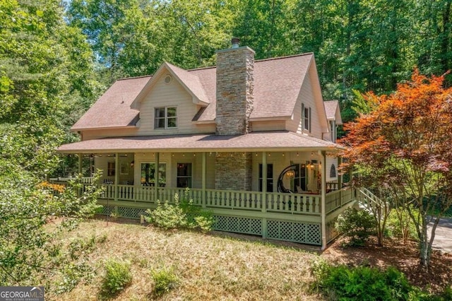 farmhouse inspired home featuring covered porch