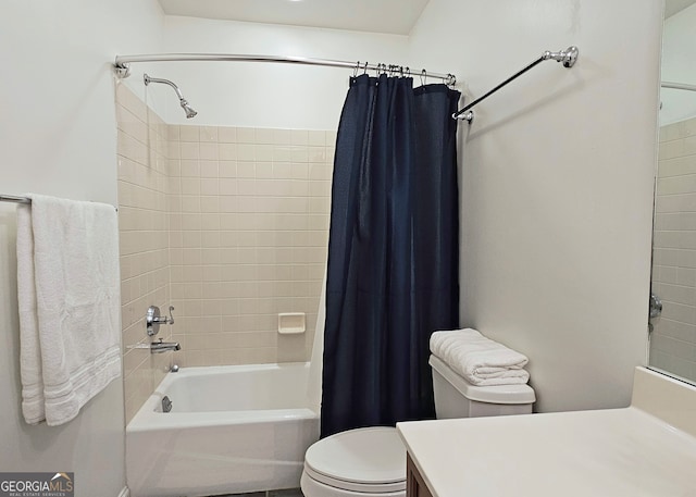 full bathroom featuring shower / bathtub combination with curtain, toilet, and vanity