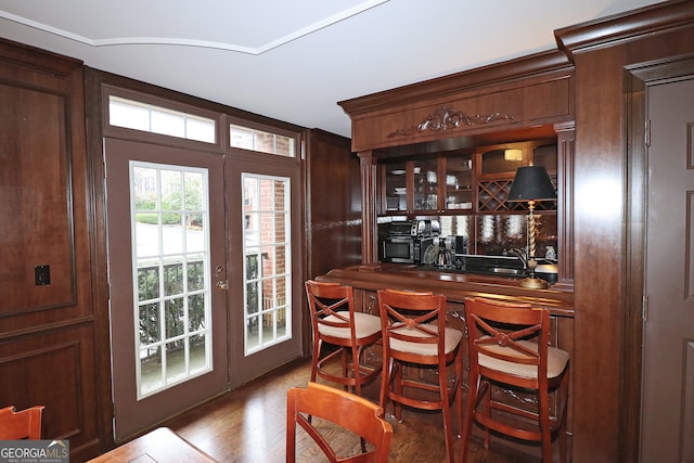 bar featuring hardwood / wood-style floors