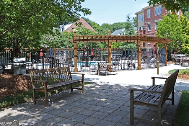 surrounding community featuring a pergola and a patio