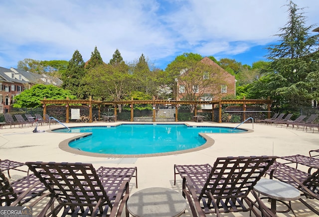 view of swimming pool with a patio area