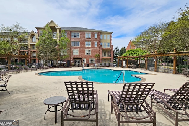 view of swimming pool featuring a patio