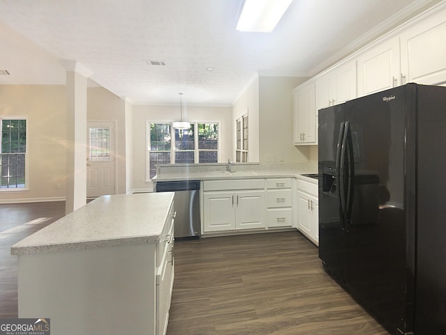 kitchen featuring dark wood-type flooring, white cabinetry, black fridge, and stainless steel dishwasher