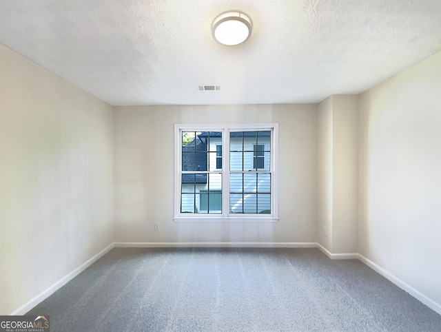 empty room featuring carpet floors