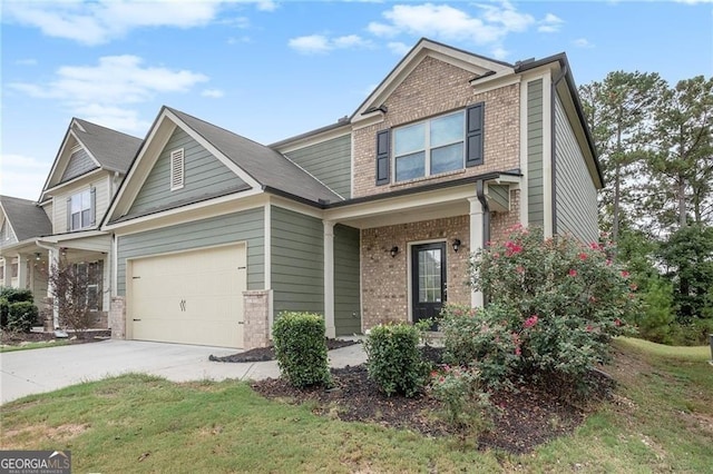 view of front of home featuring a garage and a front yard