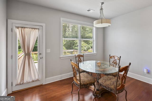 dining area with dark wood-type flooring