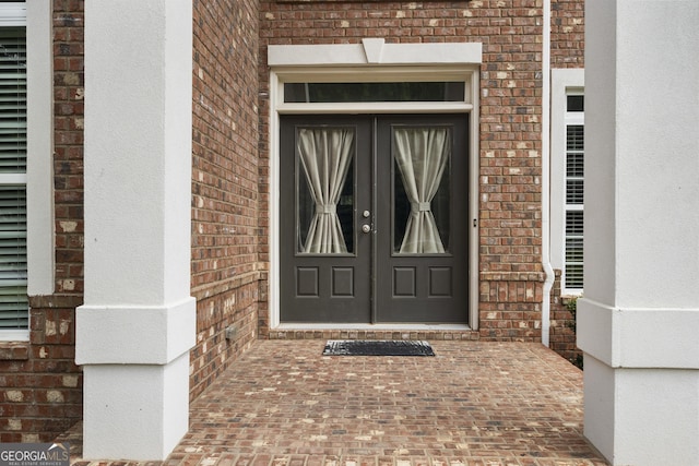 entrance to property featuring french doors