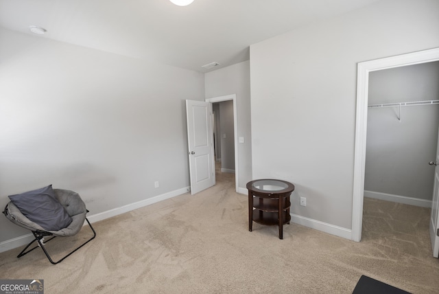 sitting room with light colored carpet