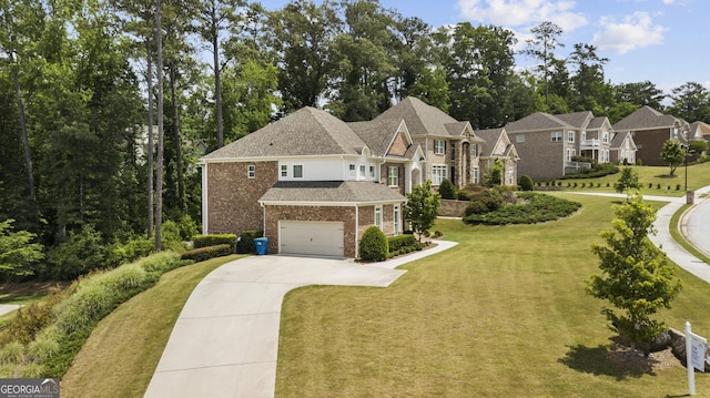 view of front of house featuring a garage and a front lawn