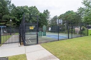 view of basketball court featuring a yard