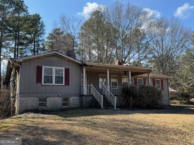 view of front of house with a front lawn and a porch