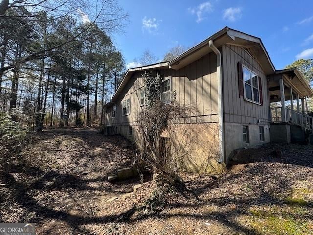 view of property exterior with a porch