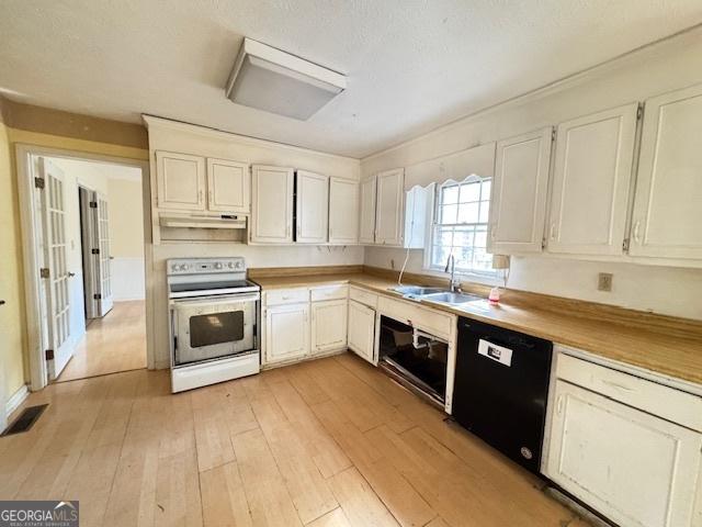 kitchen with white cabinets, sink, black dishwasher, and white range with electric cooktop