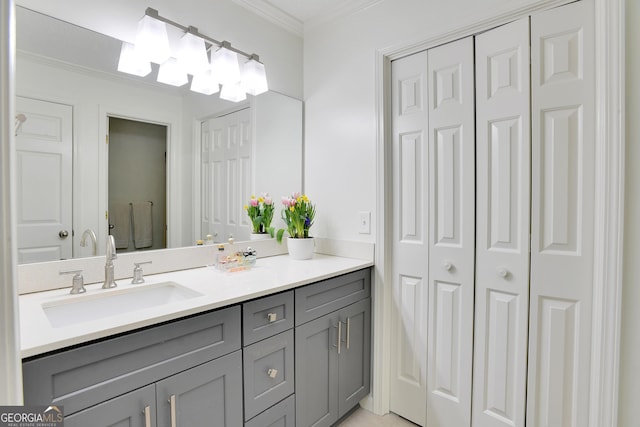 bathroom with vanity and ornamental molding