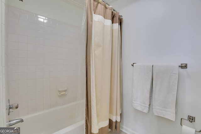 bathroom featuring shower / tub combo with curtain and crown molding