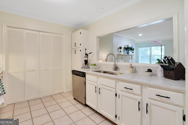 kitchen with light stone countertops, sink, white cabinets, and stainless steel dishwasher