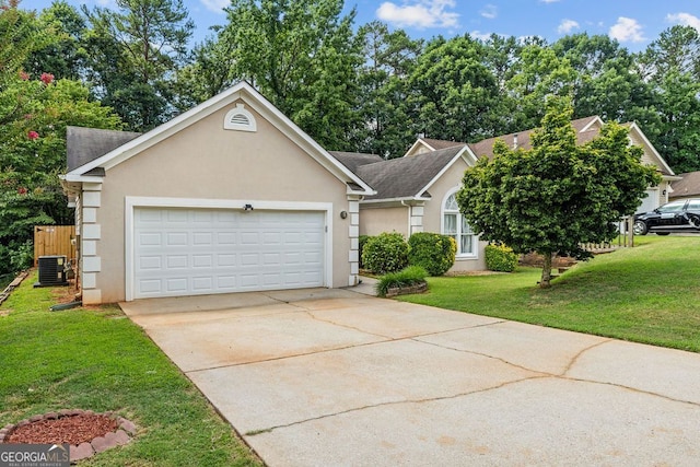 view of front of property featuring cooling unit, a garage, and a front yard