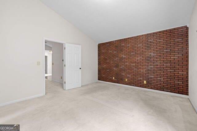 interior space featuring light colored carpet and high vaulted ceiling