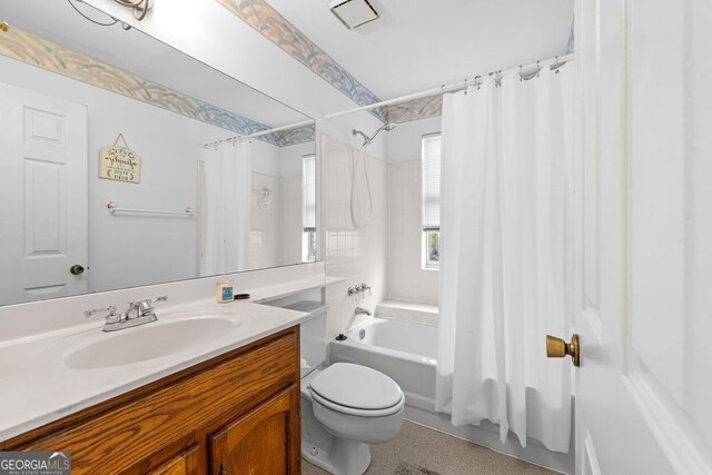 full bathroom featuring vanity, toilet, and shower / bath combo with shower curtain