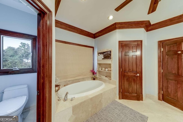 bathroom with tile patterned flooring, ornamental molding, ceiling fan, toilet, and tiled tub