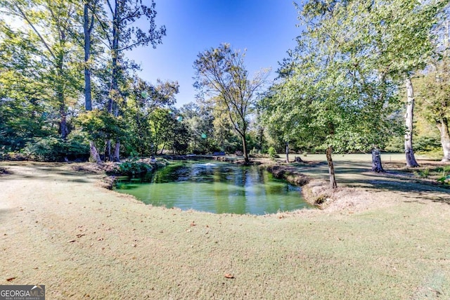 view of property's community featuring a water view