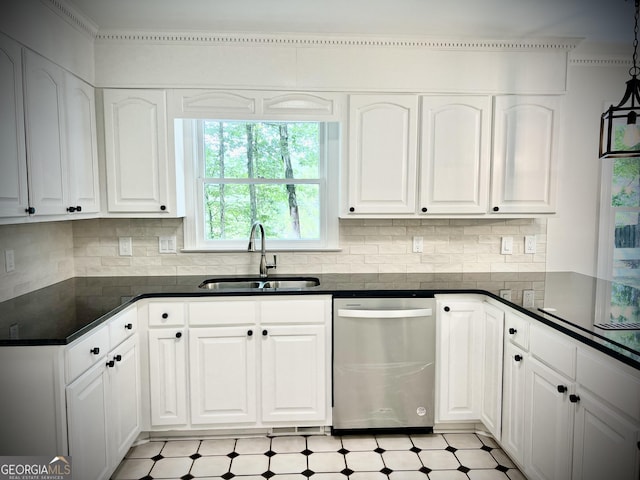 kitchen featuring dishwasher, white cabinetry, hanging light fixtures, sink, and backsplash