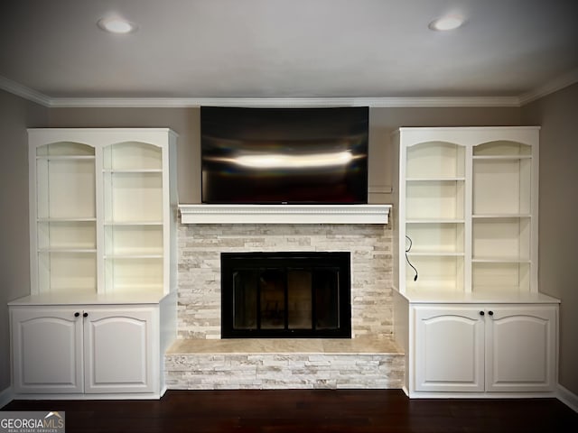 unfurnished living room with a fireplace, dark hardwood / wood-style floors, and ornamental molding