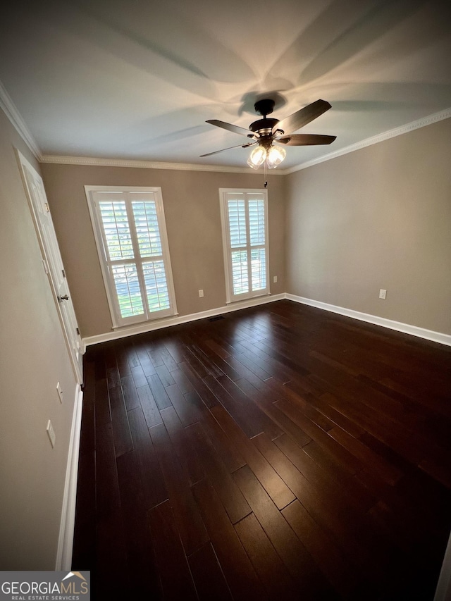 unfurnished room with ceiling fan, ornamental molding, and dark hardwood / wood-style flooring